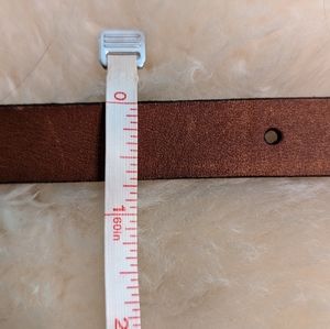 Thin brown leather belt